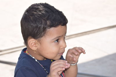 Portrait of cute boy holding camera