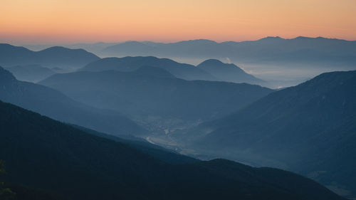 Scenic view of mountains against sky during sunset