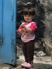 Portrait of cute girl standing outdoors