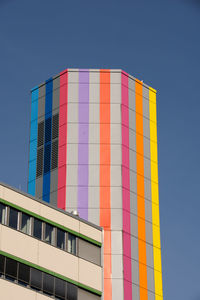 Low angle view of multi colored building against sky