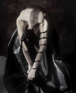 Midsection of woman covering face