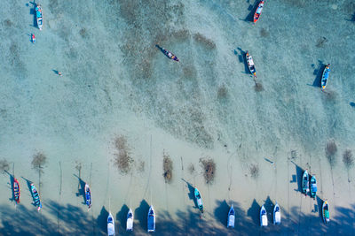 Amazing aerial top view longtail fishing boats in the tropical sea at rawai beach phuket thailand 