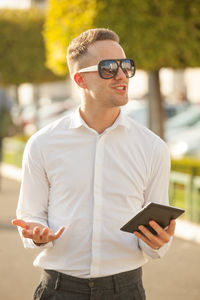 Portrait of young man using mobile phone