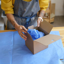 Midsection of man working on paper