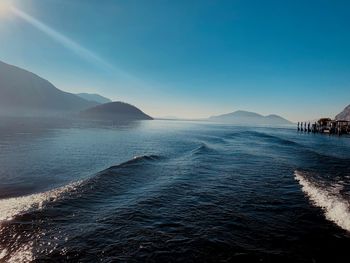 Scenic view of sea against clear blue sky