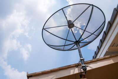 Satellite dish on house roof, satellite communication technology