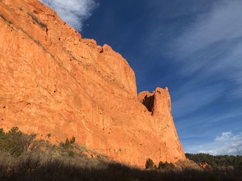 Low angle view of rock formation against sky