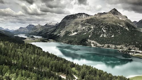 Scenic view of lake and mountains against sky
