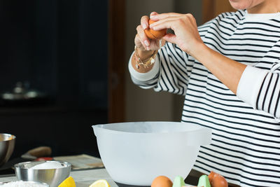 Midsection of woman preparing food