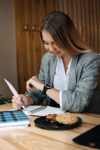 Woman sitting on table