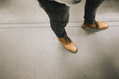 Low section of men standing on floor