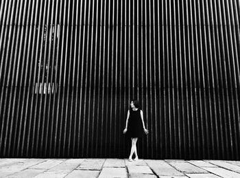 Woman standing on tiled floor