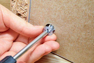 High angle view of woman holding cigarette