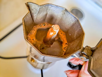 Close-up of hand holding coffee