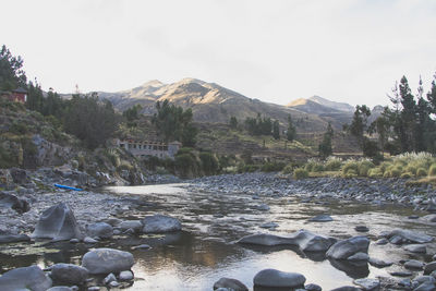 Scenic view of river and mountains