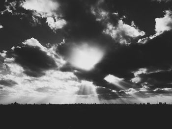 Scenic view of landscape against cloudy sky