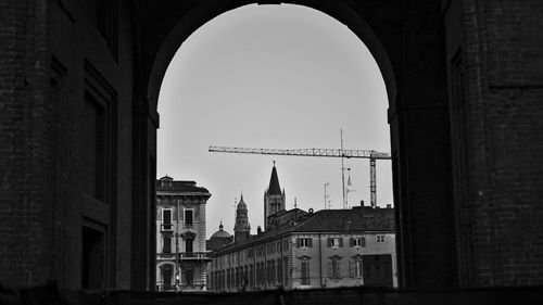 Buildings in city against clear sky