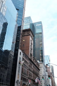 Low angle view of modern buildings against sky