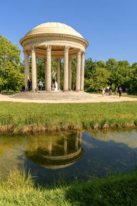 Reflection of a building in water at palace of versailles, paris, france