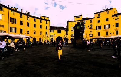 People in city against sky