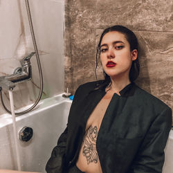 Portrait of young woman in bathroom