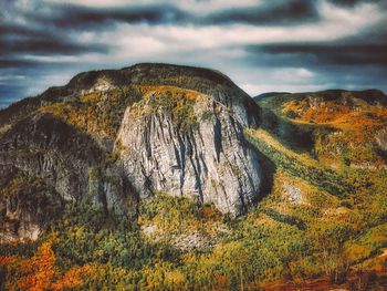 Scenic view of mountain against cloudy sky