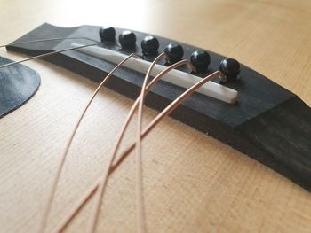 Close-up of guitar on table