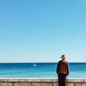 Rear view of senior man looking at sea