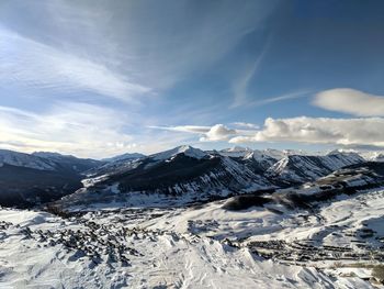 Scenic view of snowcapped mountains against sky