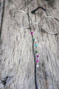 Close-up of eyeglasses on wooden table