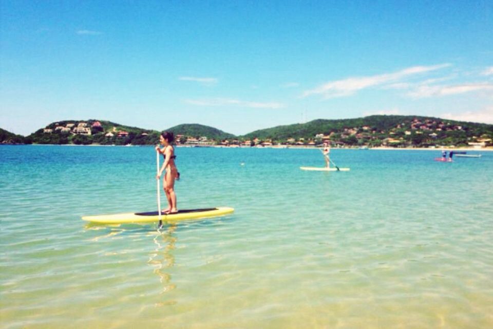 water, sea, leisure activity, lifestyles, waterfront, vacations, enjoyment, sky, blue, fun, full length, men, mountain, nature, swimming, weekend activities, scenics, rippled