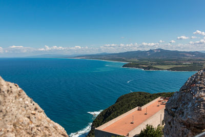 High angle view of sea against blue sky