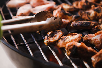 Close-up of meat on barbecue grill