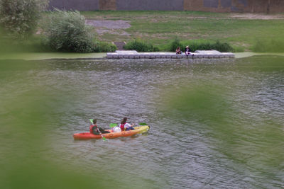 High angle view of people enjoying in river