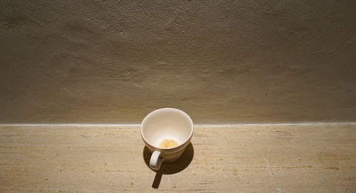 High angle view of empty coffee cup on table