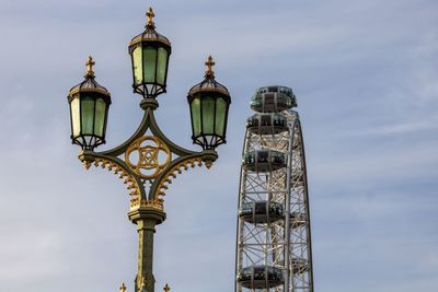 Low angle view of street light against building