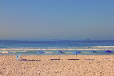 Scenic view of beach against clear sky