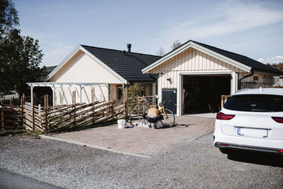 Man repairing bicycle on driveway