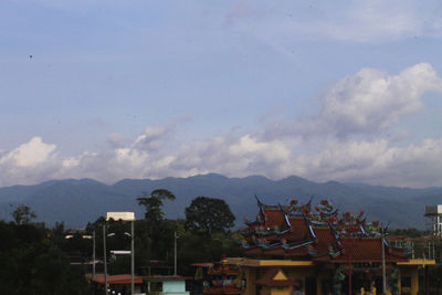 Houses with mountain range in background