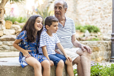 Family sitting outdoors