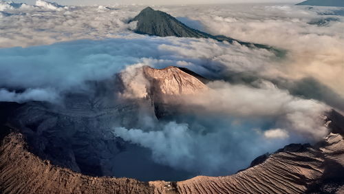 Smoke emitting from volcanic mountain against sky, in east java, indonesia.