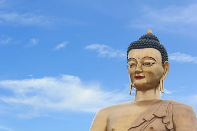 Low angle view of statue against sky