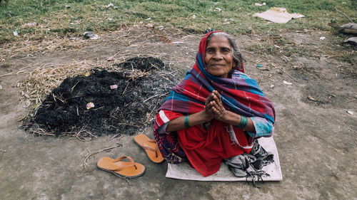 Portrait of a man sitting outdoors