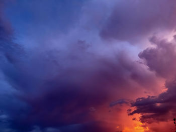 Low angle view of clouds in sky at sunset