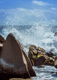 Sea waves splashing on rocks