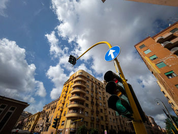 Low angle view of street light against sky