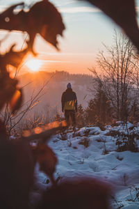 Climbing a mountain in the alps and enjoying the view of a valley in the austrian western alps.