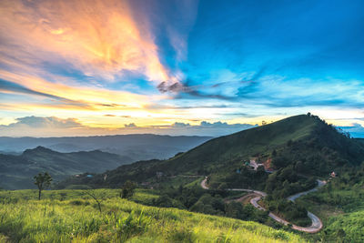 Scenic view of landscape against sky during sunset
