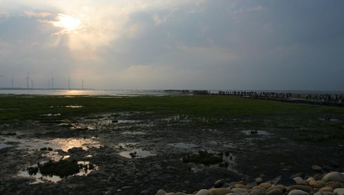 Scenic view of sea against cloudy sky