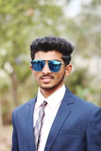 Portrait of young man wearing sunglasses